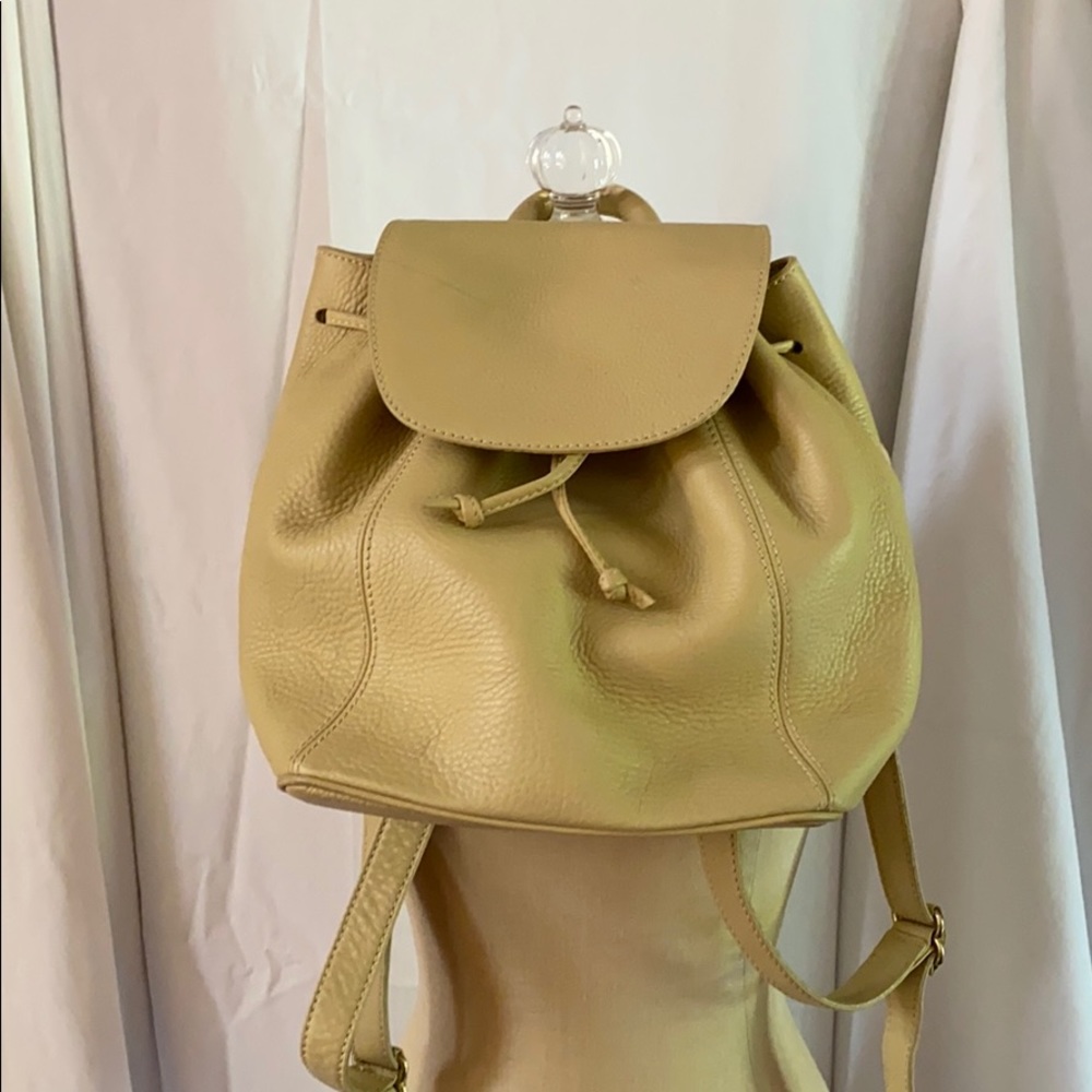 Cream colored Coach backpack